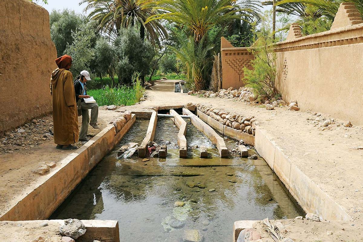 Khettara shafts in the Skoura oasis — the crater-lines that mark an invisible river